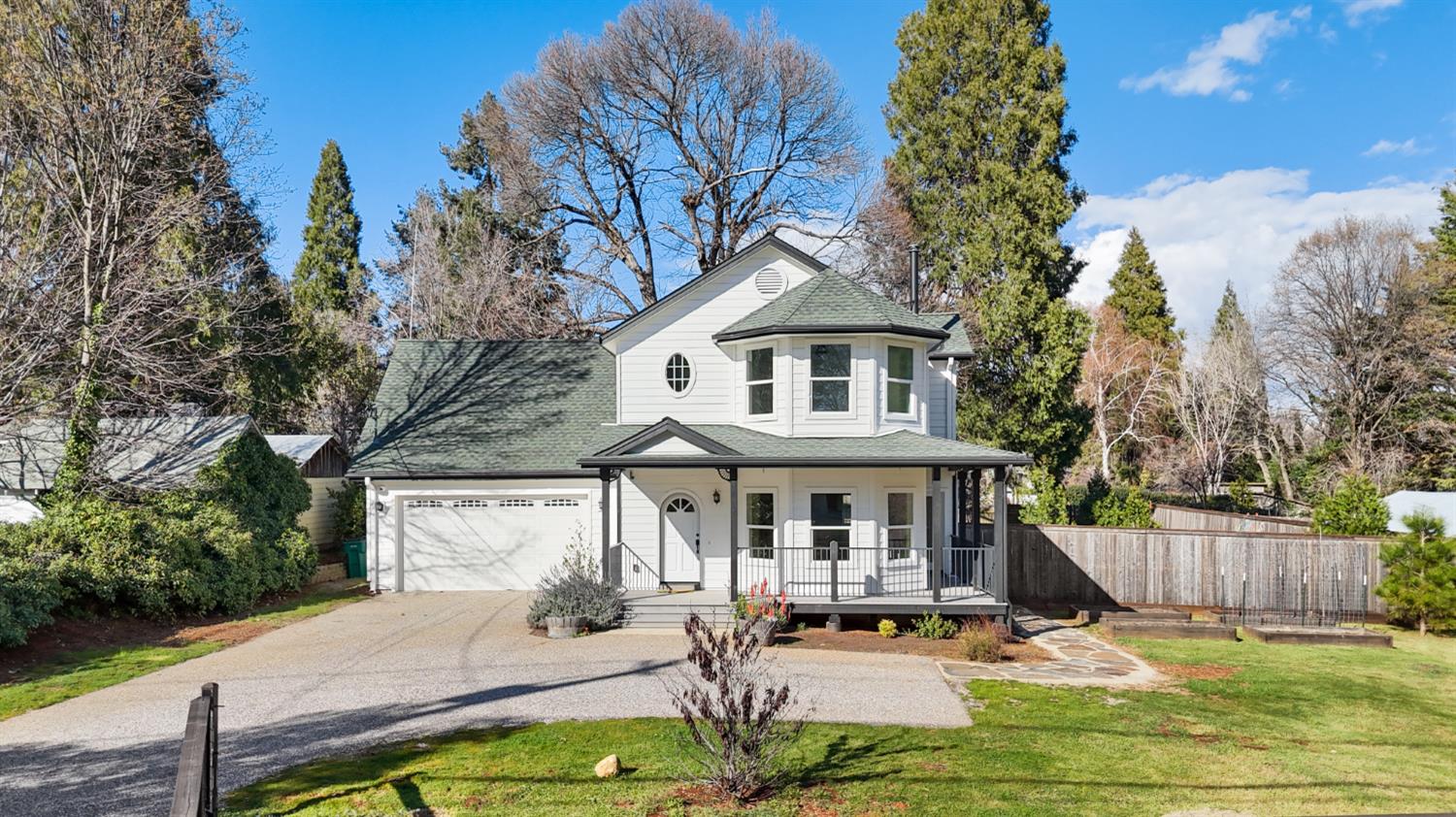 a view of a house with backyard porch and sitting area