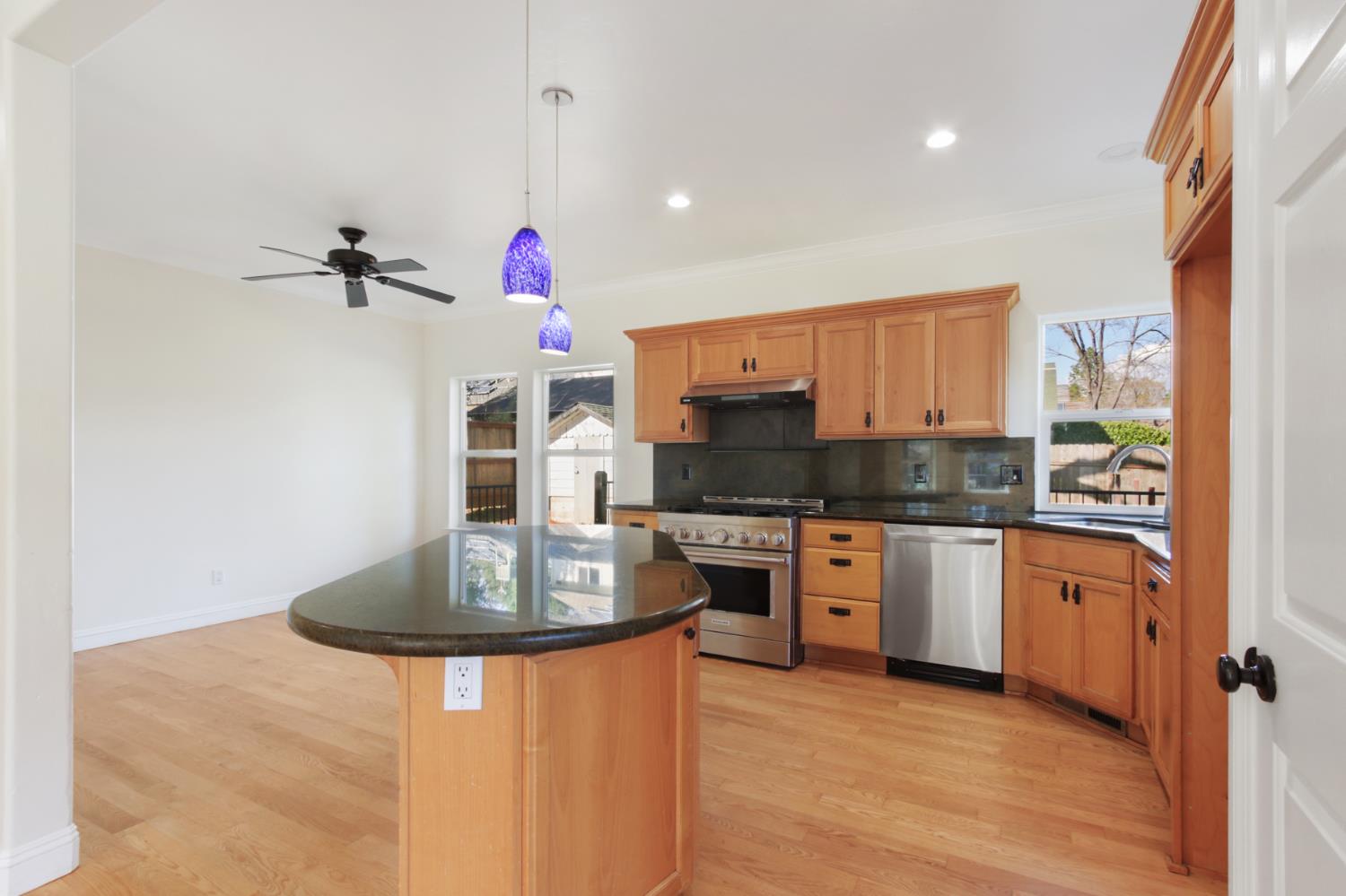 12930 Ridge Road Grass Valley, CA 95945 - Photo 18 of 62 a kitchen with stainless steel appliances granite countertop a sink and cabinets
