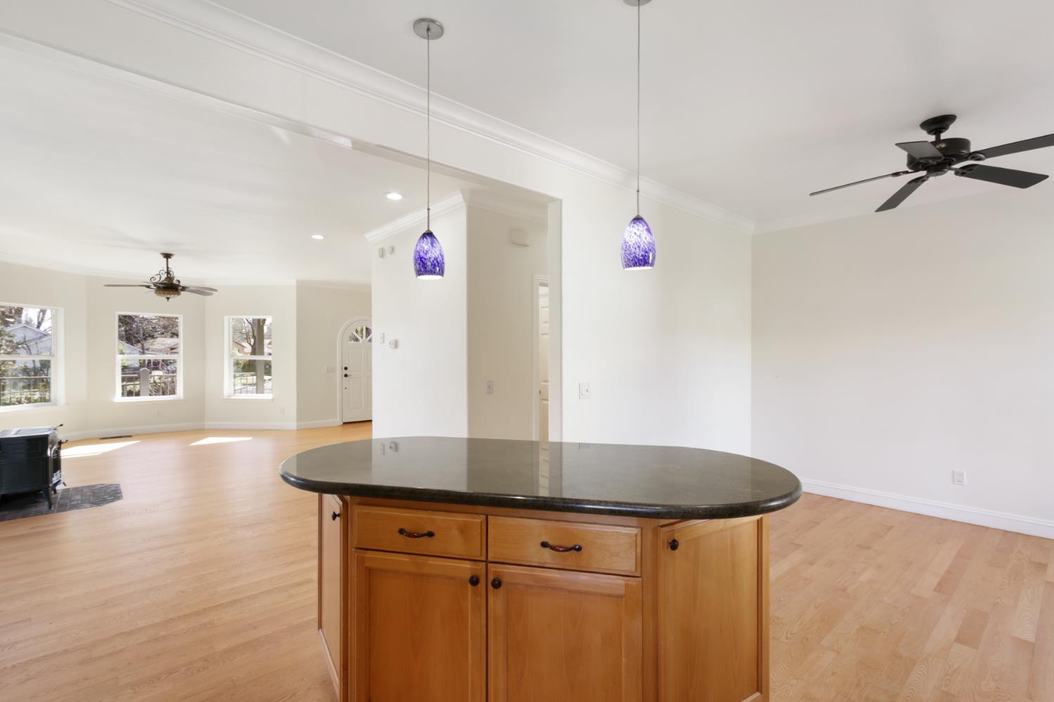 12930 Ridge Road Grass Valley, CA 95945 - Photo 24 of 62 a kitchen with kitchen island a sink a stove and wooden floors