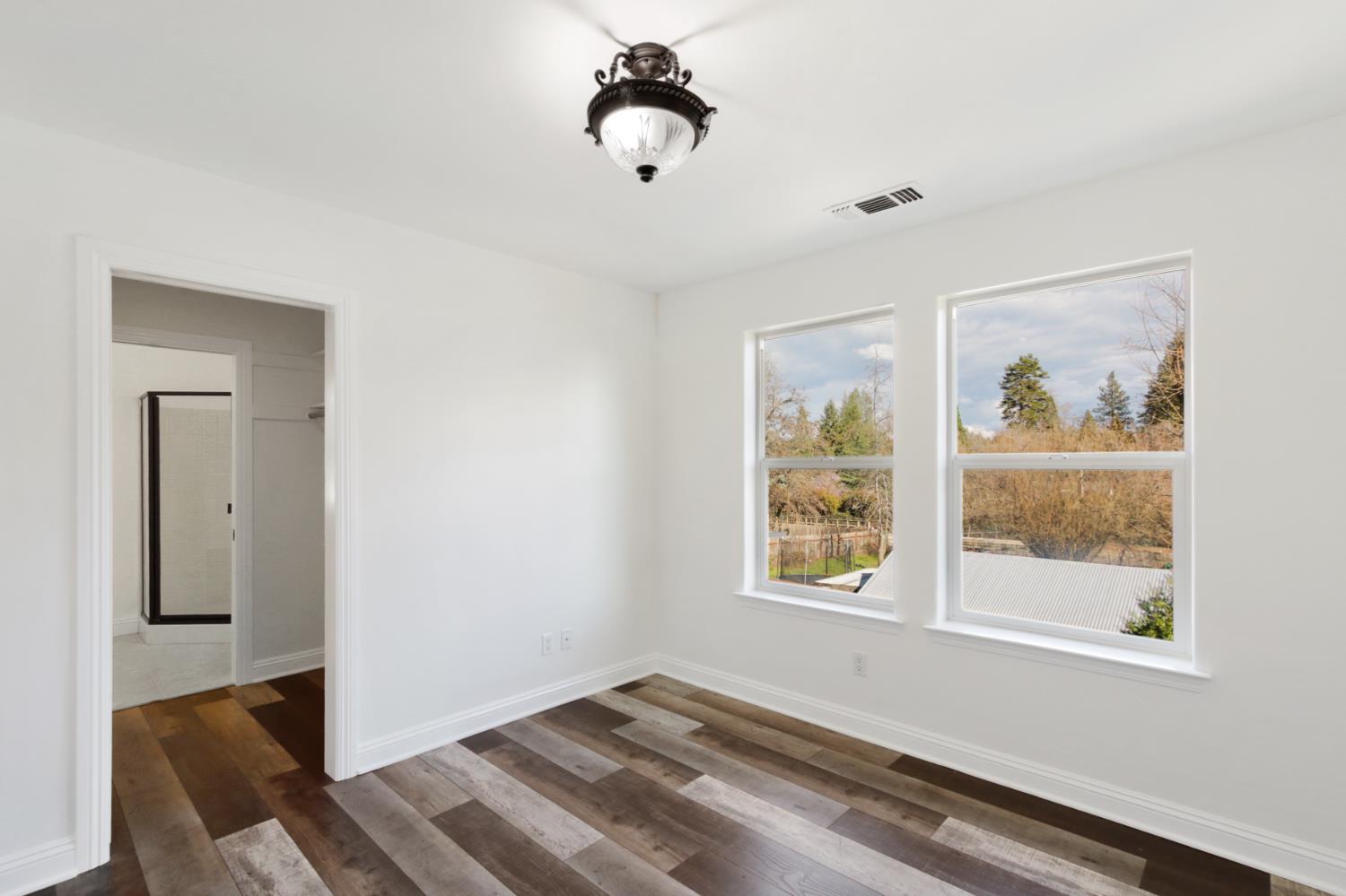 12930 Ridge Road Grass Valley, CA 95945 - Photo 37 of 62 a view of an empty room with a window