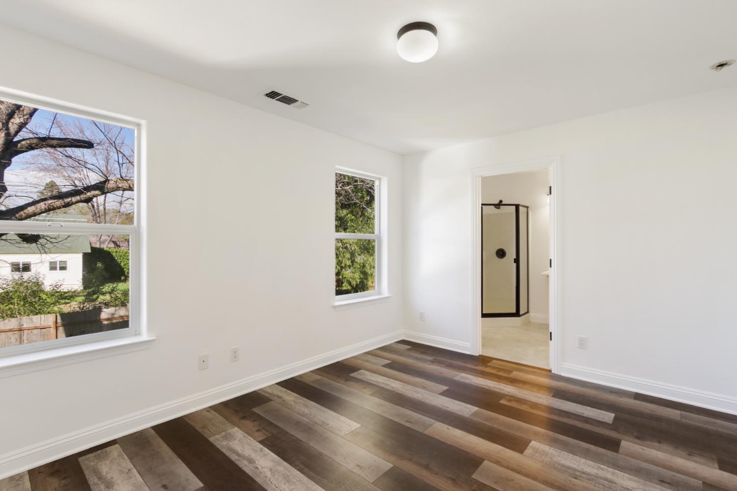 12930 Ridge Road Grass Valley, CA 95945 - Photo 41 of 62 a view of empty room with window and ceiling fan