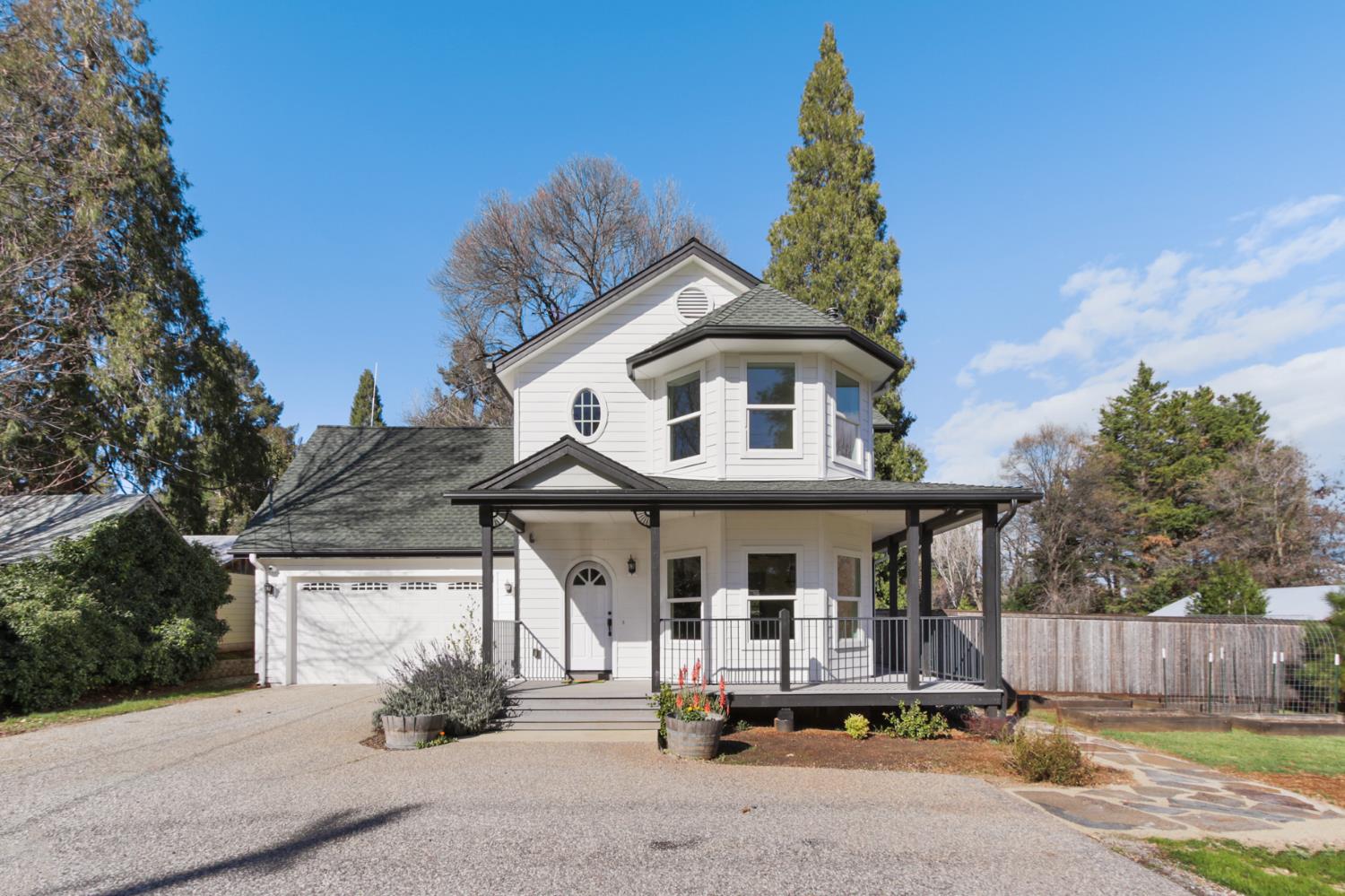 12930 Ridge Road Grass Valley, CA 95945 - Photo 52 of 62 a front view of a house with a garden