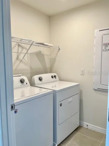 a utility room with dryer and washer