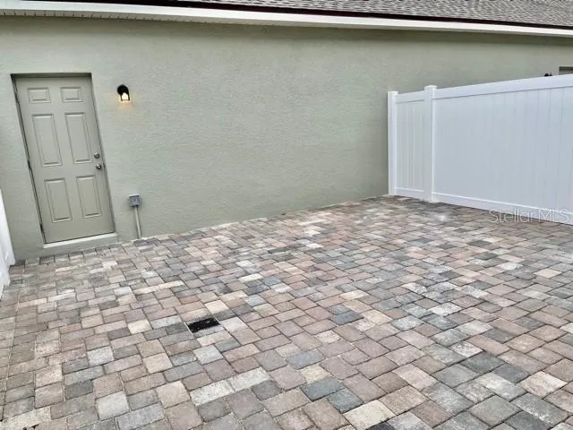 a view of a livingroom with wooden floor and cabinet