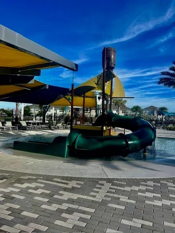 a view of swimming pool with outdoor seating