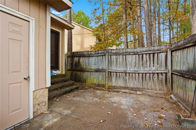 a view of a small yard from a balcony