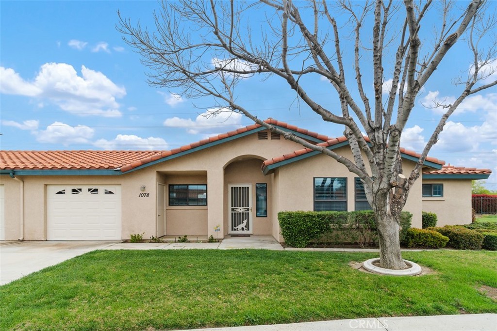 1078 Merrill Circle Hemet, CA 92545 - Photo 1 of 33 a front view of a house with a yard