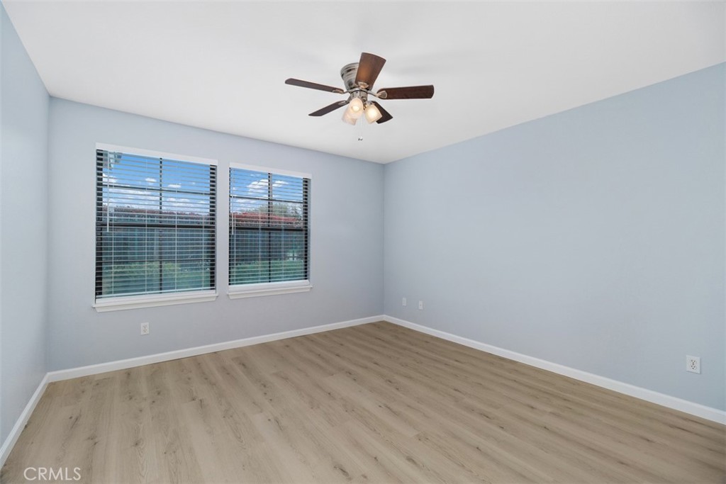 1078 Merrill Circle Hemet, CA 92545 - Photo 19 of 33 a view of empty room with wooden floor and fan