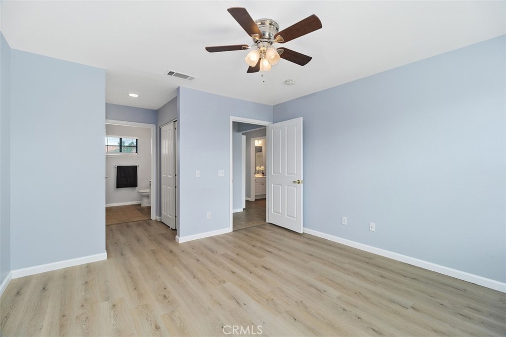 1078 Merrill Circle Hemet, CA 92545 - Photo 20 of 33 an empty room with closet and a ceiling fan