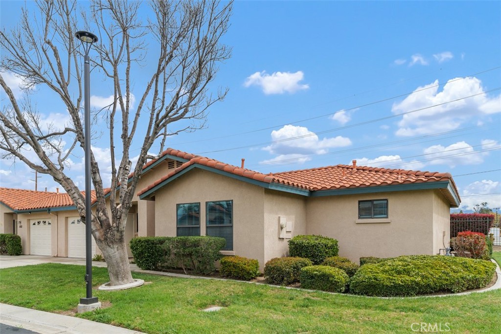 1078 Merrill Circle Hemet, CA 92545 - Photo 2 of 33 a view of a house with a yard and potted plants