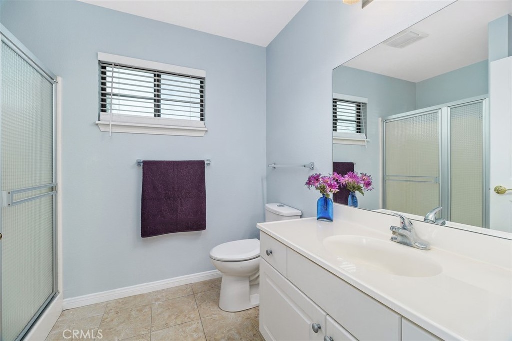 1078 Merrill Circle Hemet, CA 92545 - Photo 22 of 33 a bathroom with a sink toilet and vanity