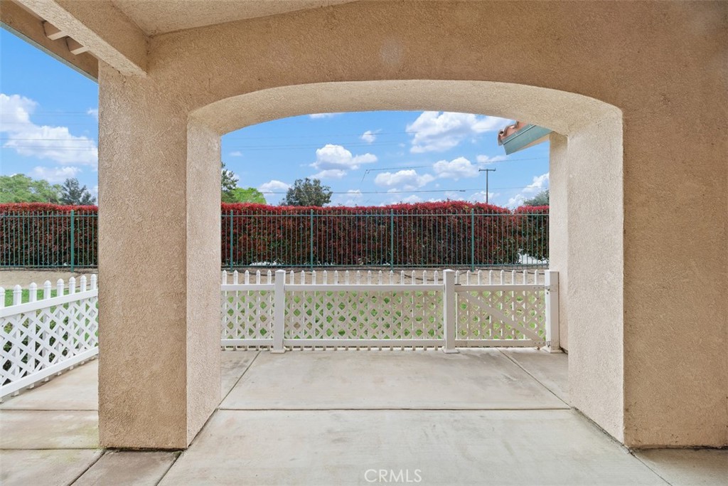 1078 Merrill Circle Hemet, CA 92545 - Photo 23 of 33 a view of backyard with a small cabin and a chair