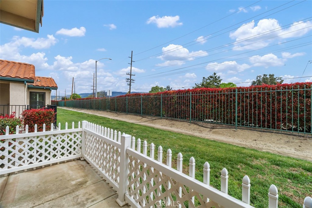 1078 Merrill Circle Hemet, CA 92545 - Photo 25 of 33 a view of a street with wooden fence