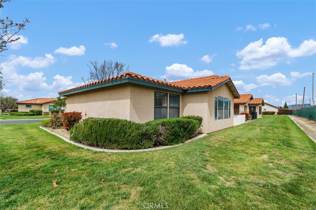 1078 Merrill Circle Hemet, CA 92545 - Photo 27 of 33 a view of a house with a backyard and basketball court