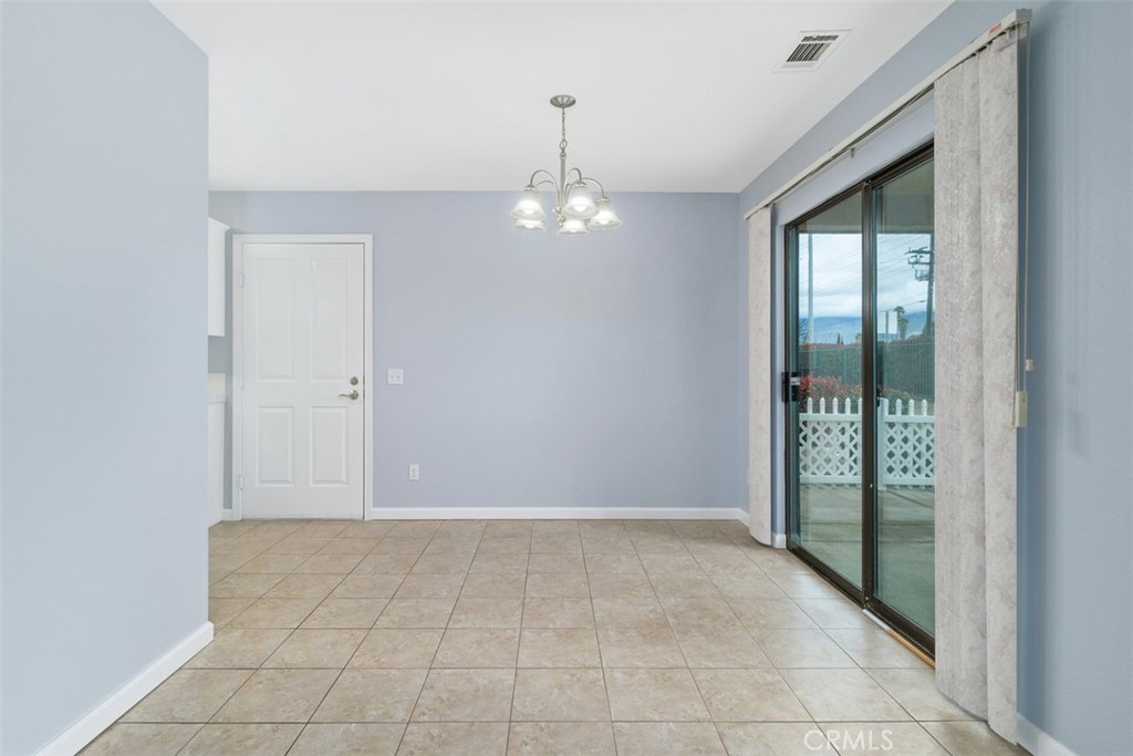 1078 Merrill Circle Hemet, CA 92545 - Photo 9 of 33 a view of an empty room with glass door
