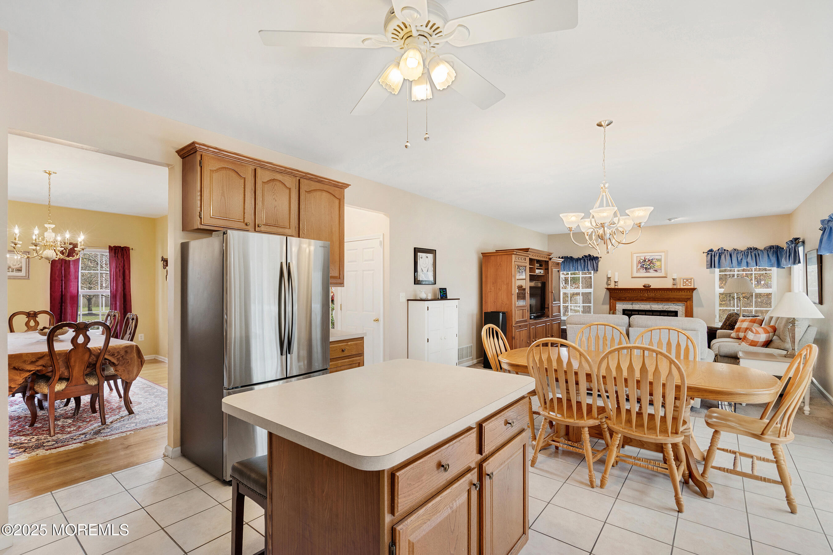 18 Serendipity Drive Jackson, NJ 08527 - Photo 12 of 46 a kitchen that has a table chairs and a refrigerator