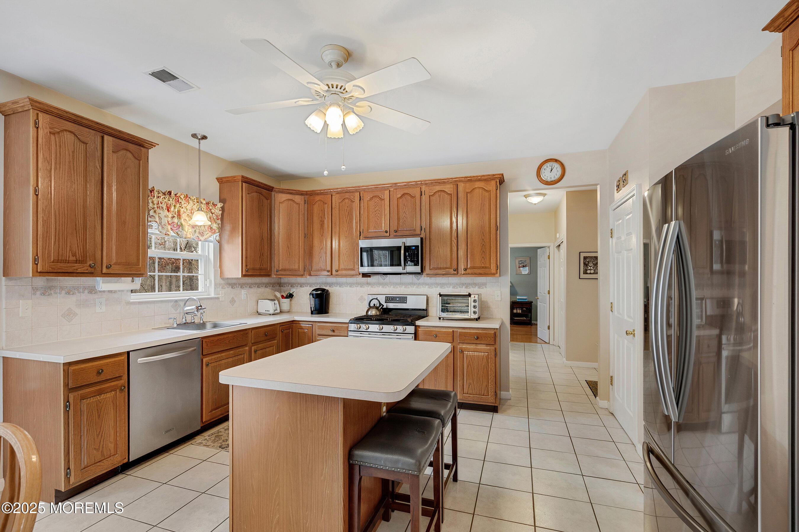 18 Serendipity Drive Jackson, NJ 08527 - Photo 13 of 46 a kitchen with a refrigerator a sink and cabinets
