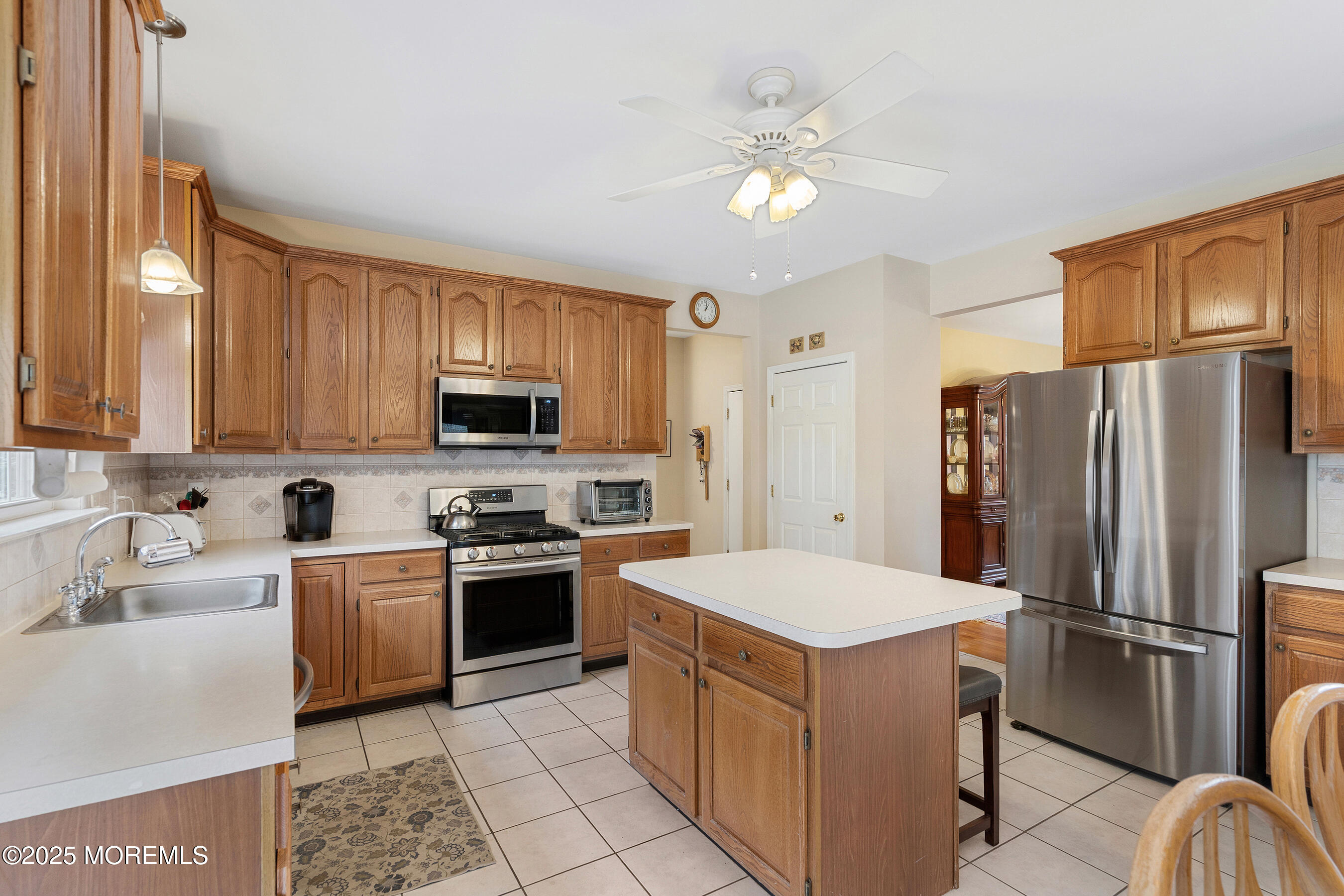 18 Serendipity Drive Jackson, NJ 08527 - Photo 14 of 46 a kitchen with a refrigerator sink and stove