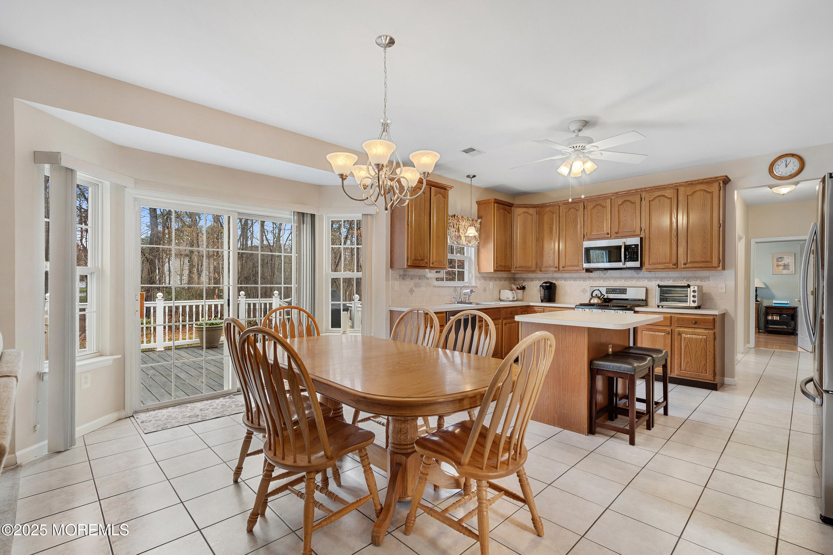 18 Serendipity Drive Jackson, NJ 08527 - Photo 15 of 46 a view of a dining room with furniture and chandelier