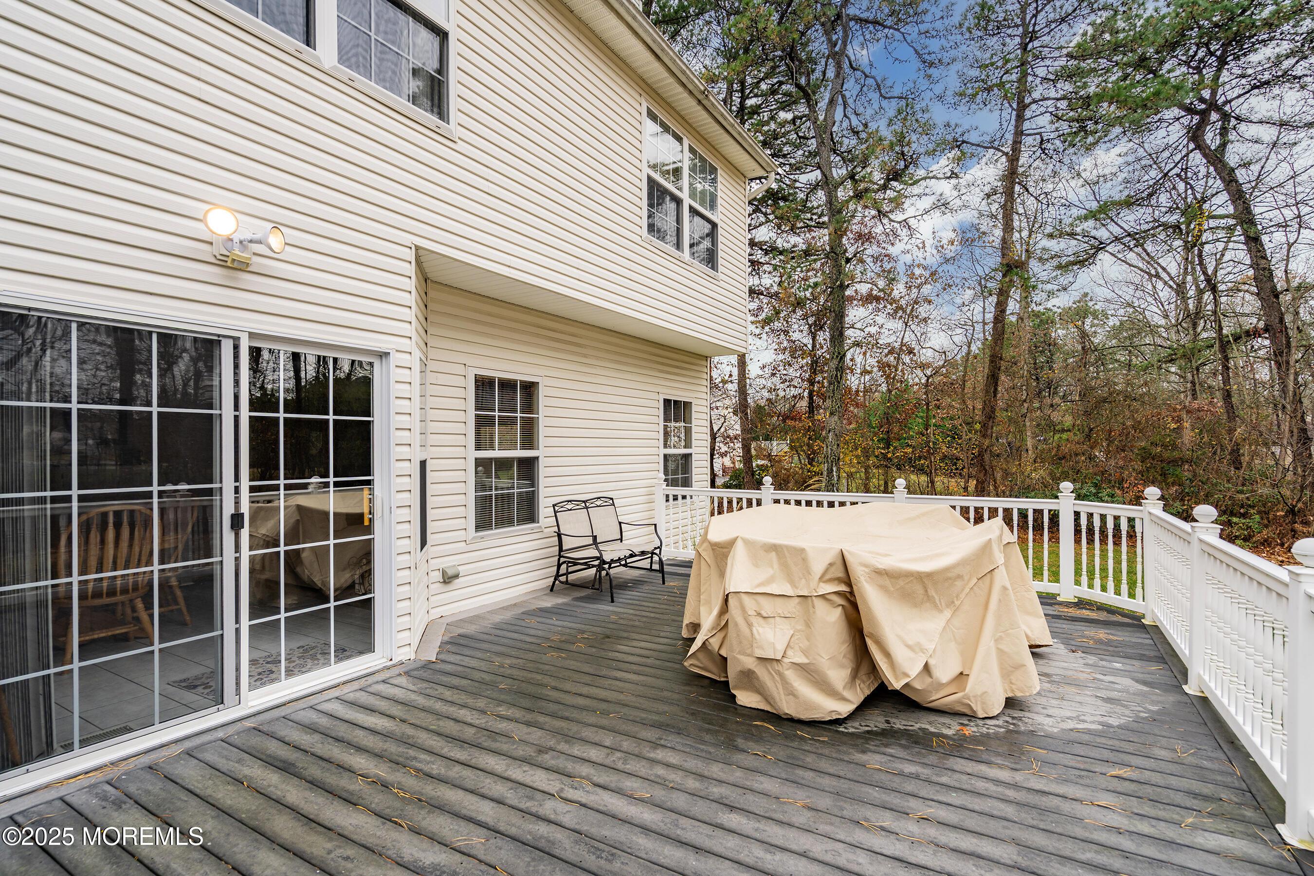 18 Serendipity Drive Jackson, NJ 08527 - Photo 16 of 46 a view of a roof deck with couches and wooden floor