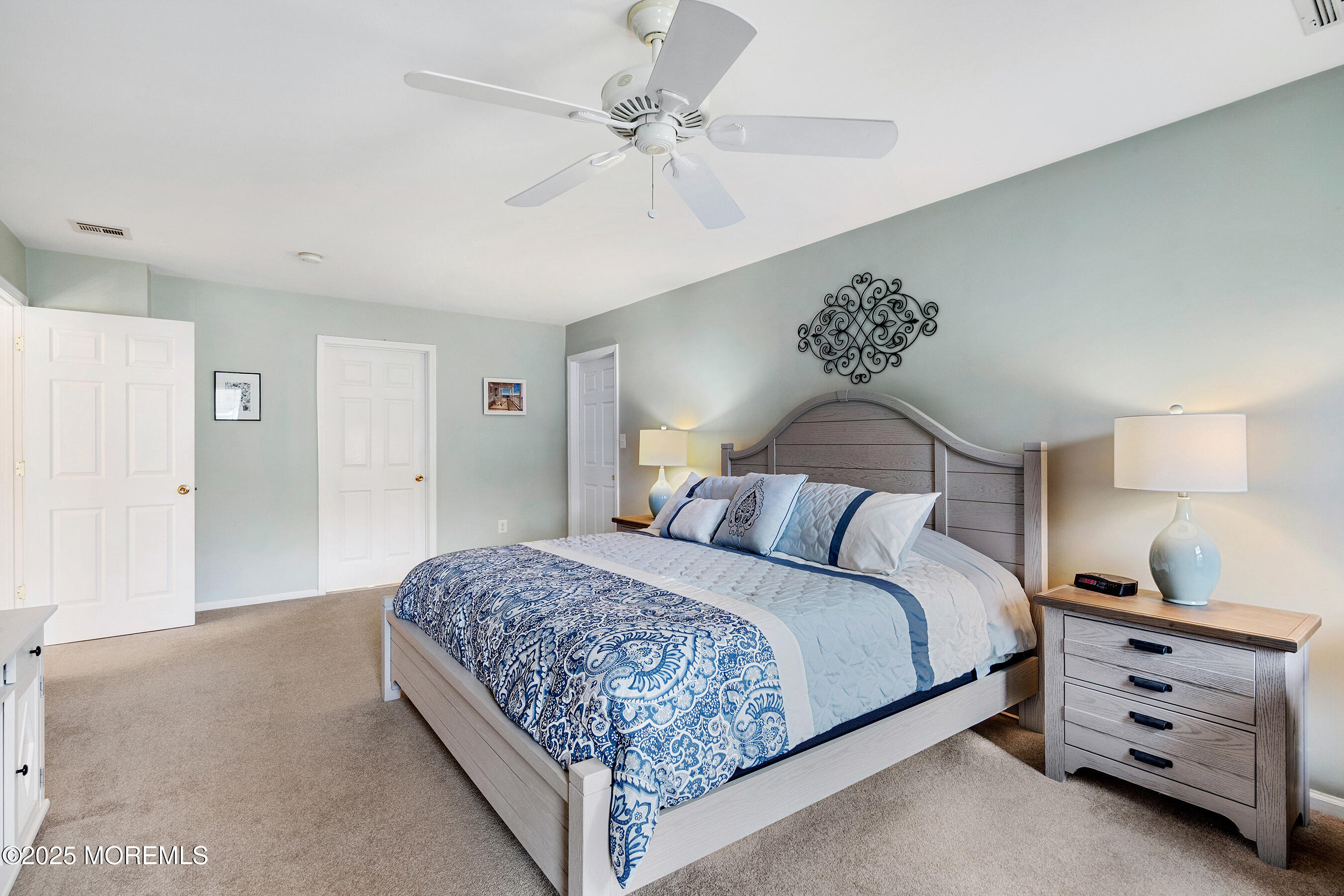 18 Serendipity Drive Jackson, NJ 08527 - Photo 24 of 46 a bedroom with a bed and a chandelier