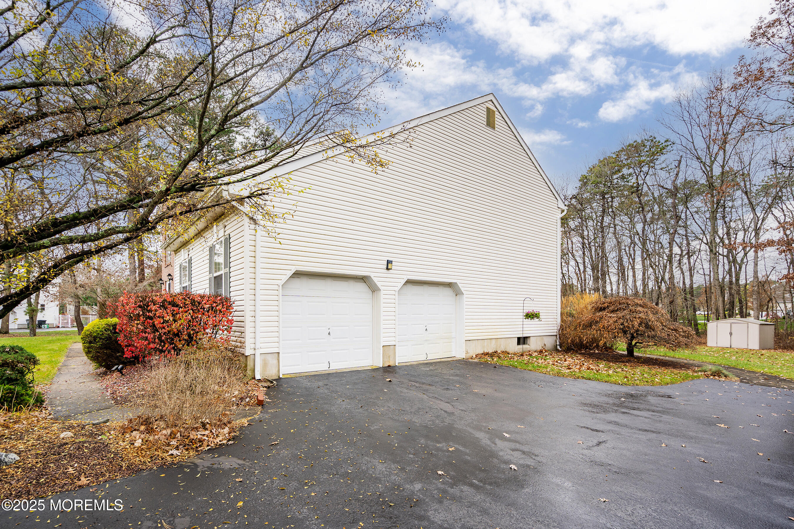 18 Serendipity Drive Jackson, NJ 08527 - Photo 3 of 46 a front view of a house with a yard and garage