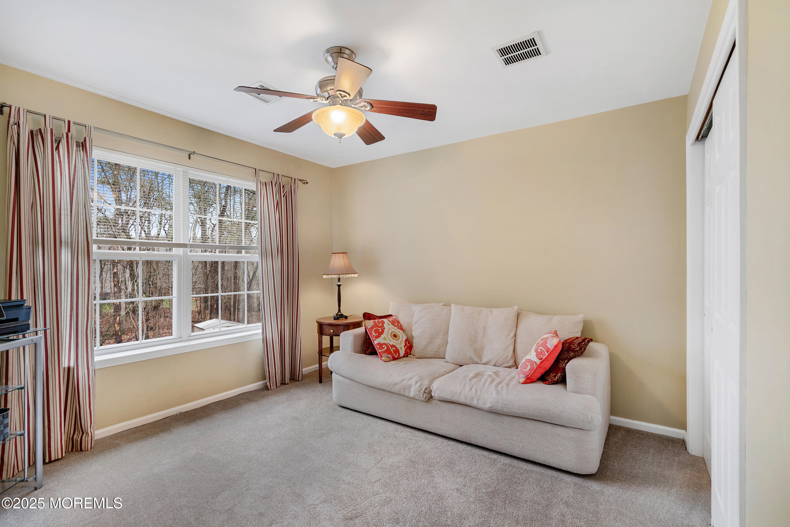 18 Serendipity Drive Jackson, NJ 08527 - Photo 31 of 46 a living room with furniture and a window