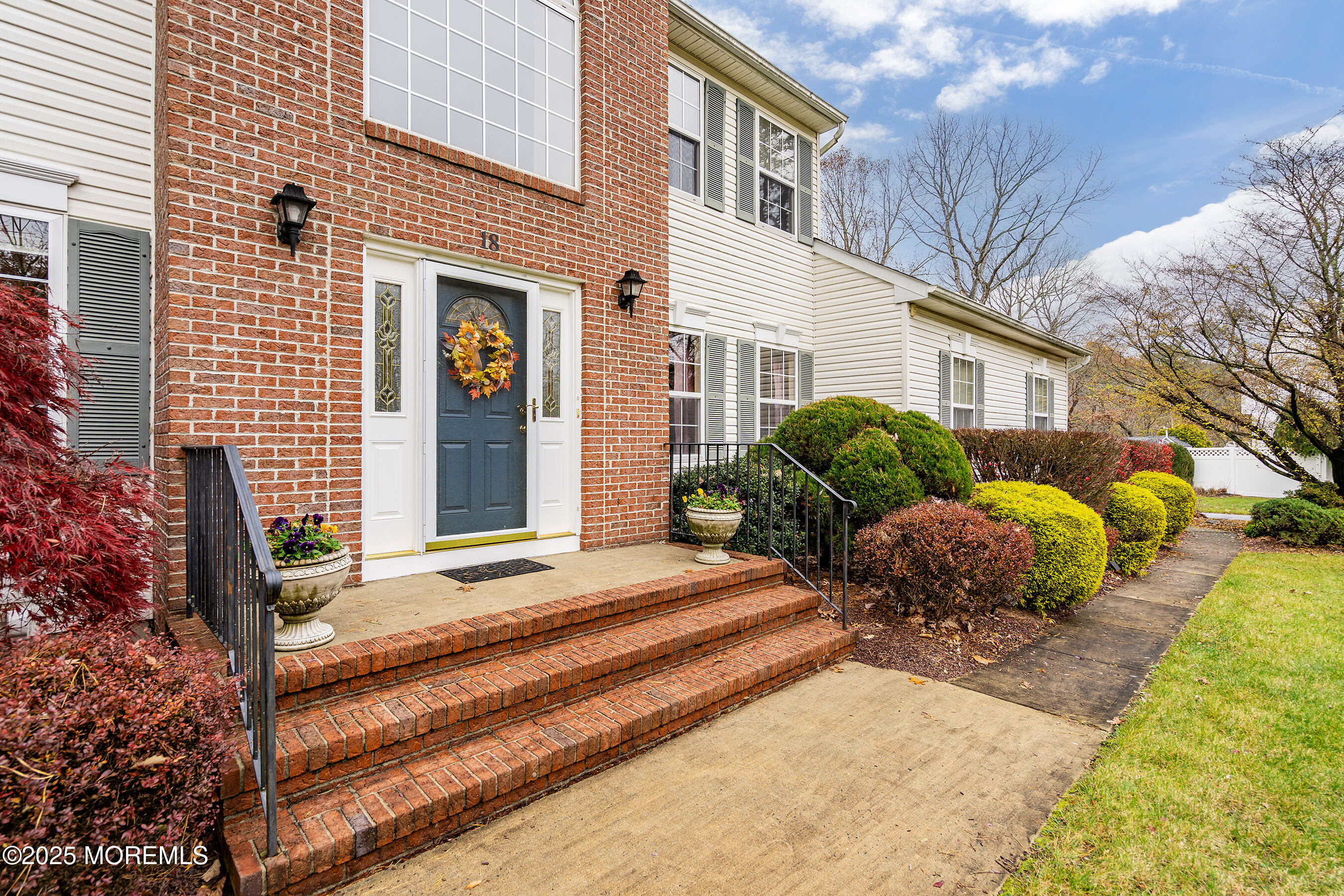 18 Serendipity Drive Jackson, NJ 08527 - Photo 4 of 46 a house with potted plants in front of it