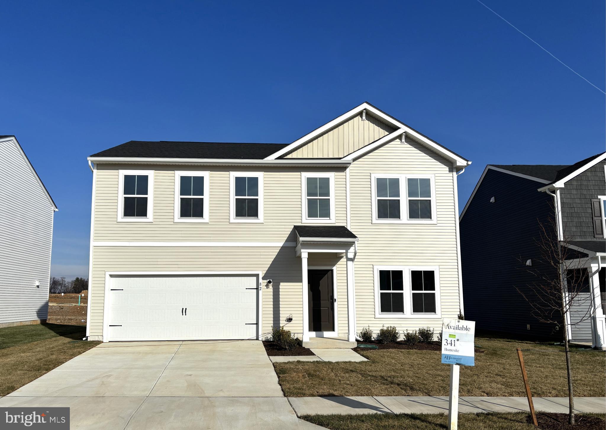 a front view of a house with yard