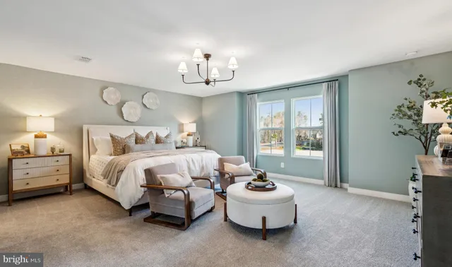 a bedroom with bed and window