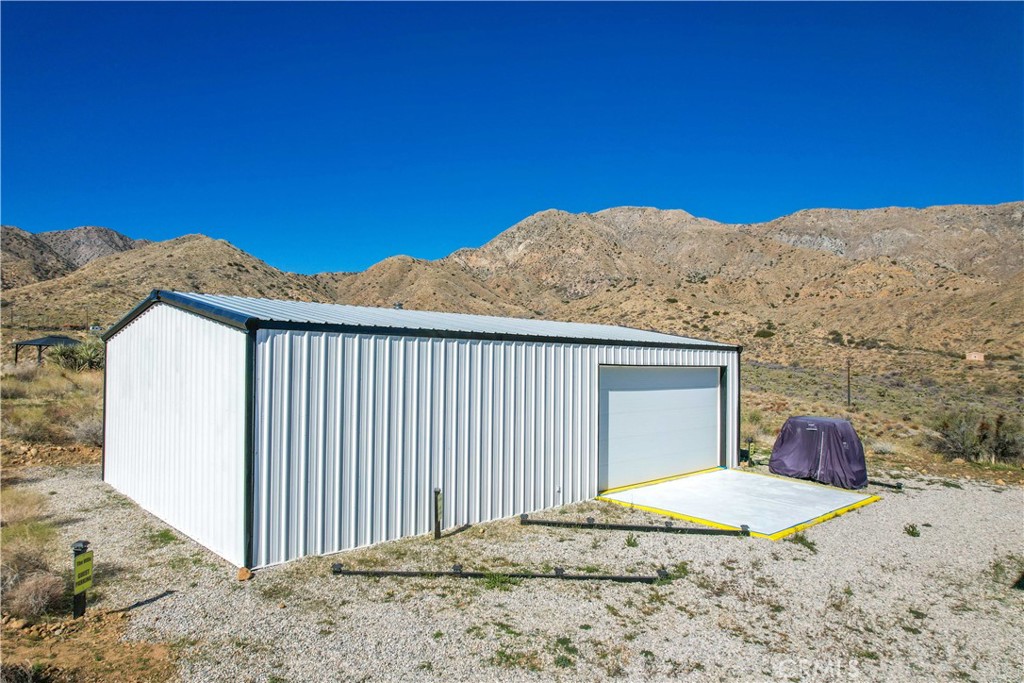 49490 Big Morongo Canyon Road Morongo Valley, CA 92256 - Photo 57 of 75 a backyard of a house with a yard