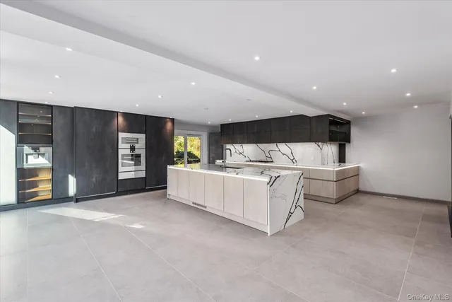 a view of a room with furniture and window