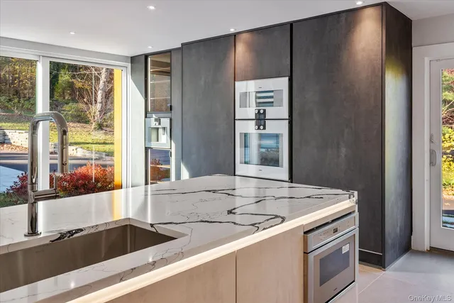 a kitchen with a sink and a window