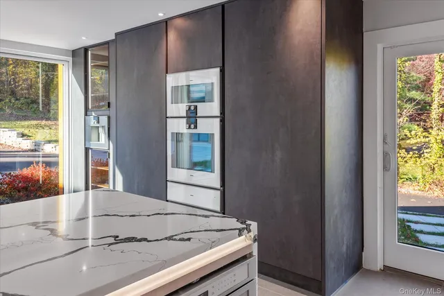 a view of kitchen and wooden floor
