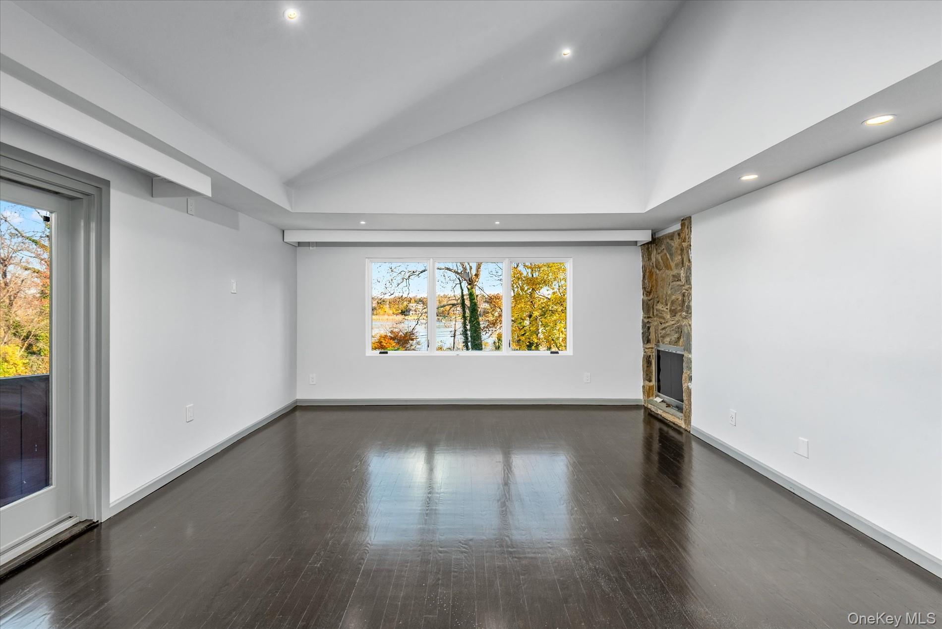 369 East Shore Road Great Neck, NY 11023 - Photo 26 of 50 an empty room with window and wooden floor