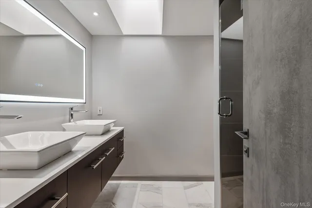 a bathroom with a sink and a mirror