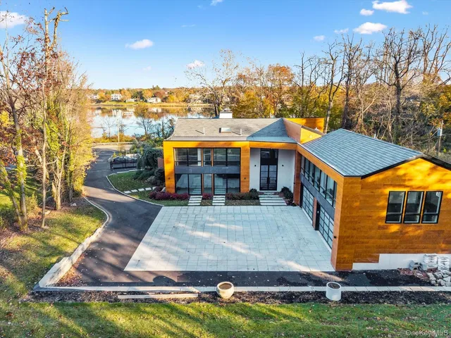 a view of a house with swimming pool yard and sitting area