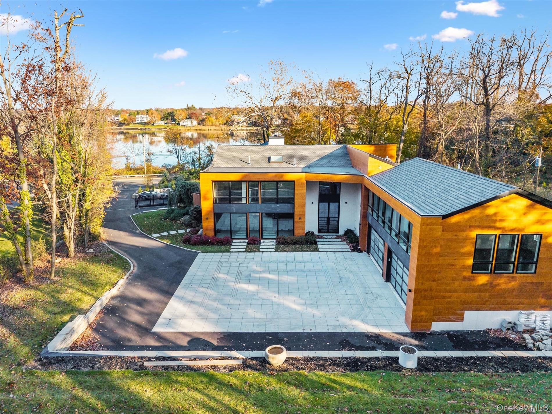 369 East Shore Road Great Neck, NY 11023 - Photo 39 of 50 a view of a house with swimming pool yard and sitting area