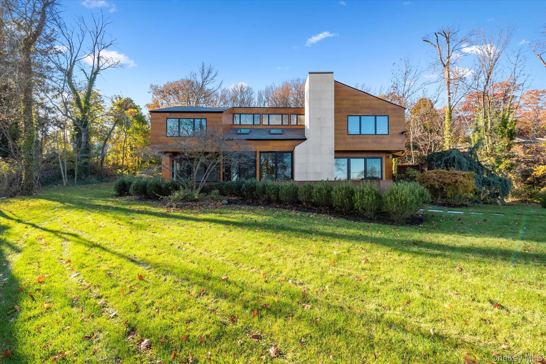 369 East Shore Road Great Neck, NY 11023 - Photo 41 of 50 a view of a house with swimming pool