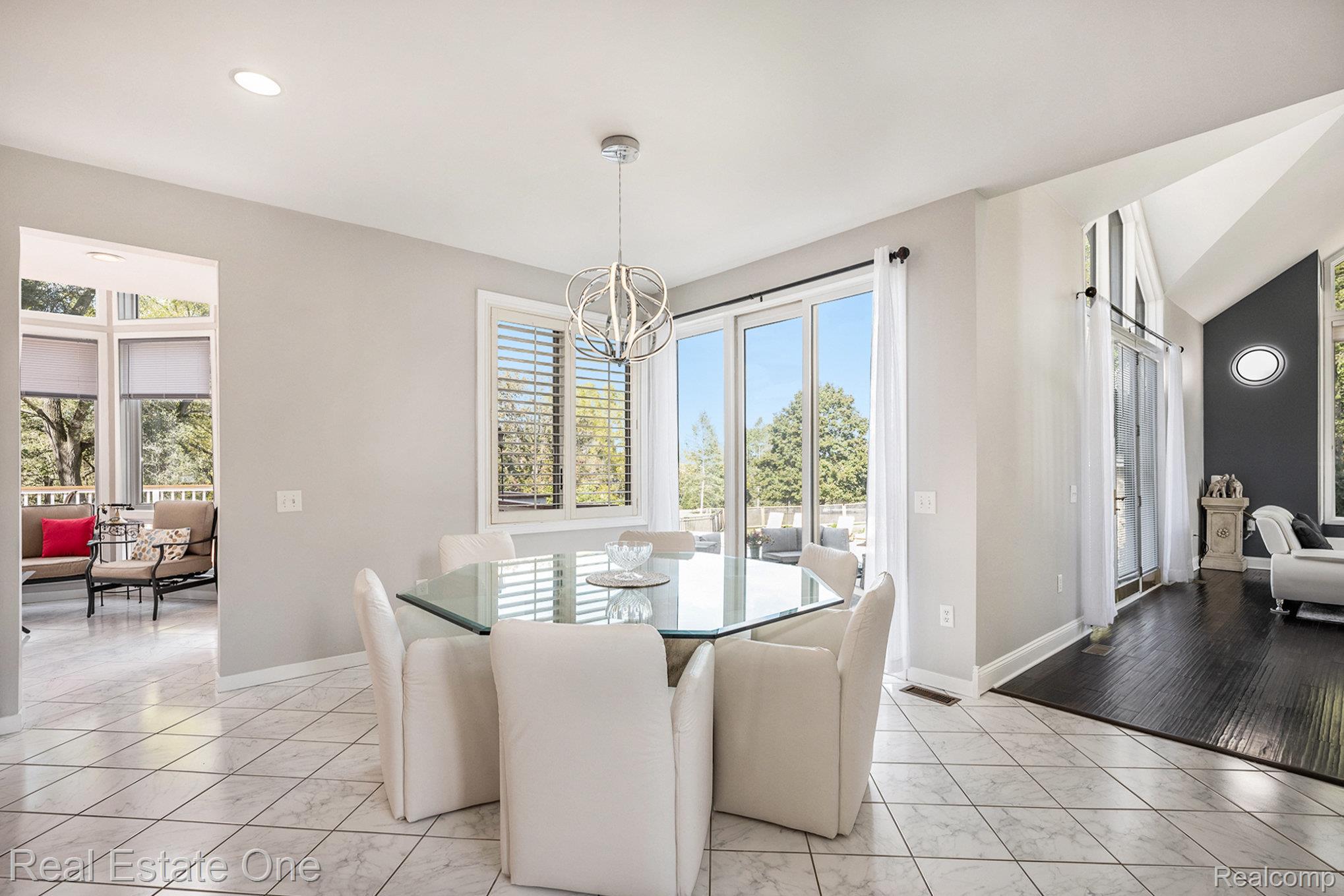 5772 North Rochester Road Rochester, MI 48306 - Photo 5 of 50 Dining area featuring plenty of natural light, a chandelier, recessed lighting, and lofted ceiling