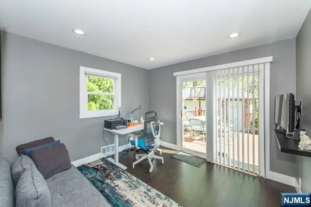 a work room with furniture and a window