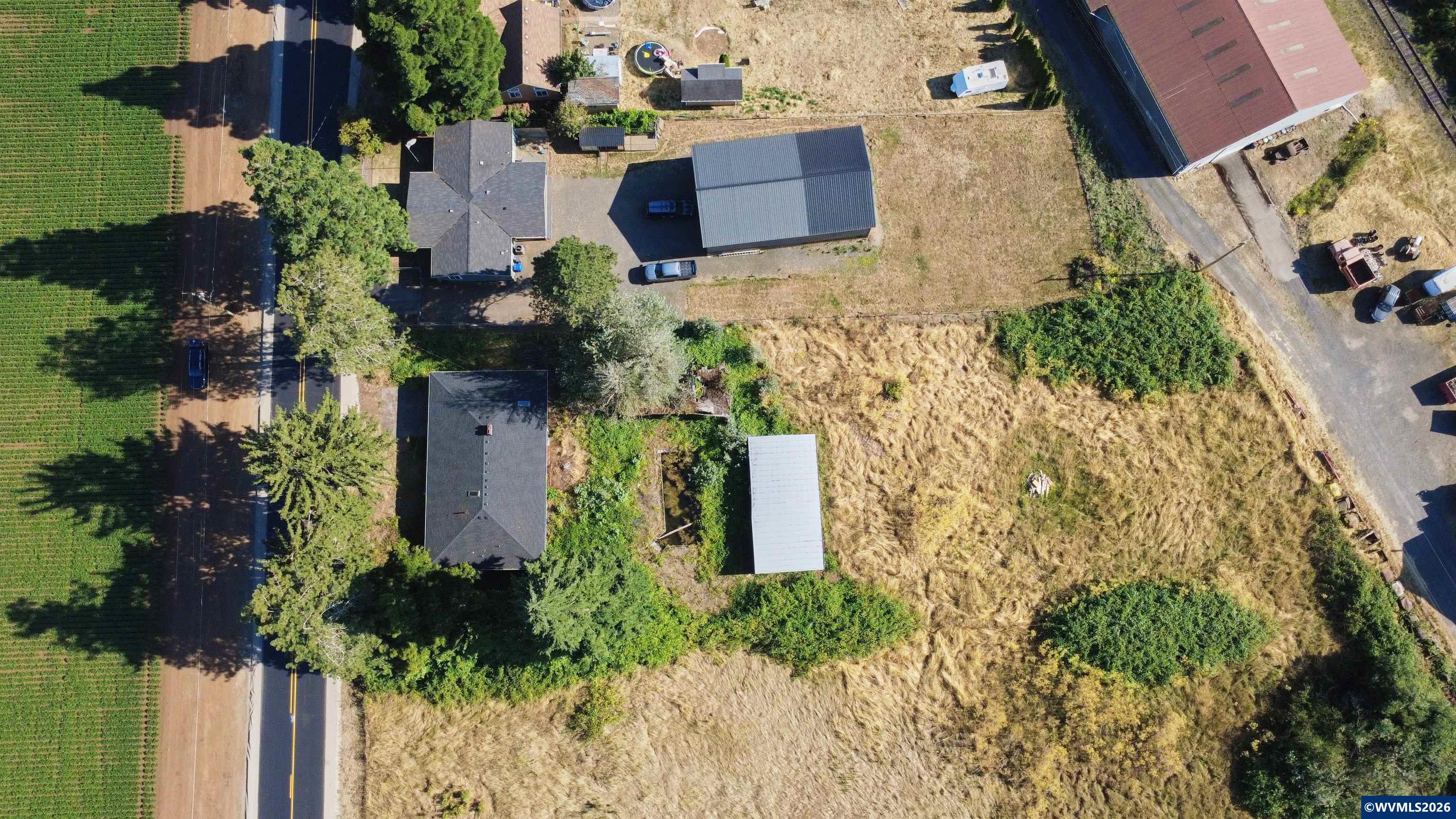 5495 Howell Prairie Road Southeast Aumsville, OR 97325 - Photo 20 of 22 an aerial view of a house with a yard and garden