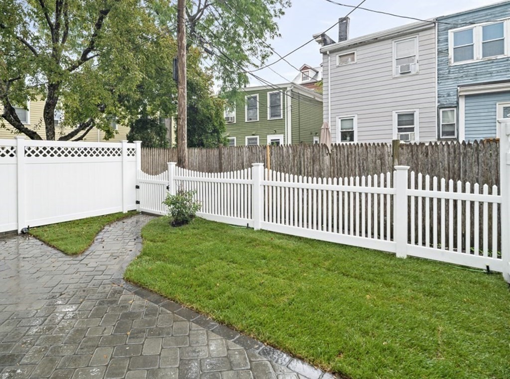 4 Spring St Place Cambridge, MA 02141 - Photo 11 of 12 a front view of a house having yard