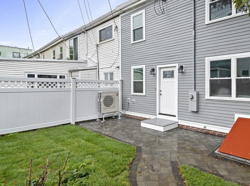 4 Spring St Place Cambridge, MA 02141 - Photo 12 of 12 a front view of a house with garden