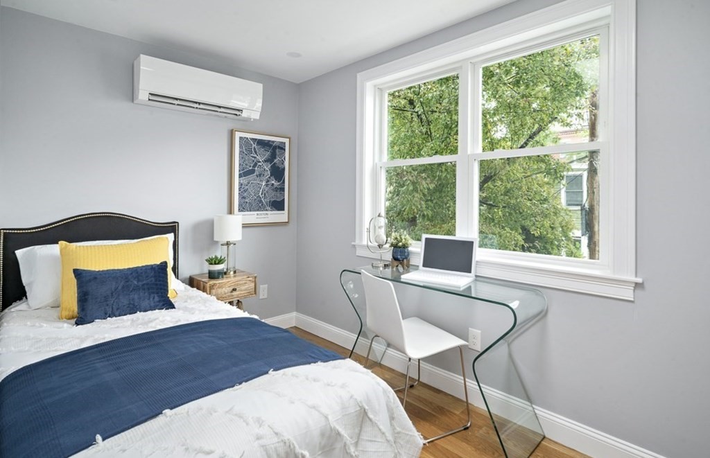 4 Spring St Place Cambridge, MA 02141 - Photo 7 of 12 a bedroom with a bed and a window