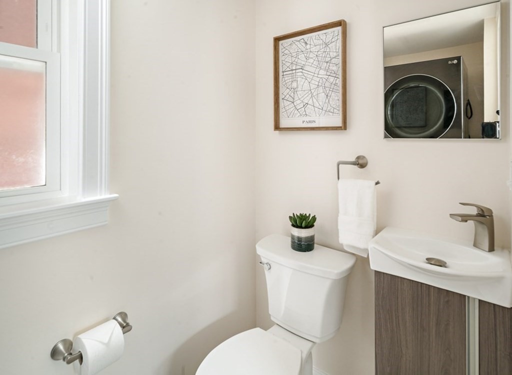 4 Spring St Place Cambridge, MA 02141 - Photo 10 of 12 a bathroom with a sink mirror and toilet