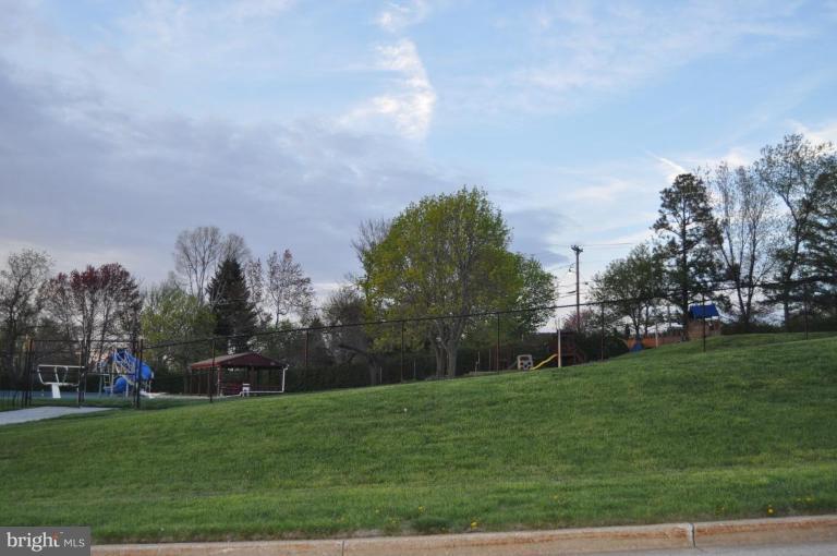 10507 Gateridge Road Cockeysville, MD 21030 - Photo 11 of 18 a view of a green field with trees in the background