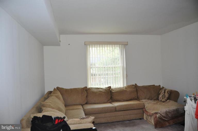 10507 Gateridge Road Cockeysville, MD 21030 - Photo 15 of 18 a living room with furniture and a window