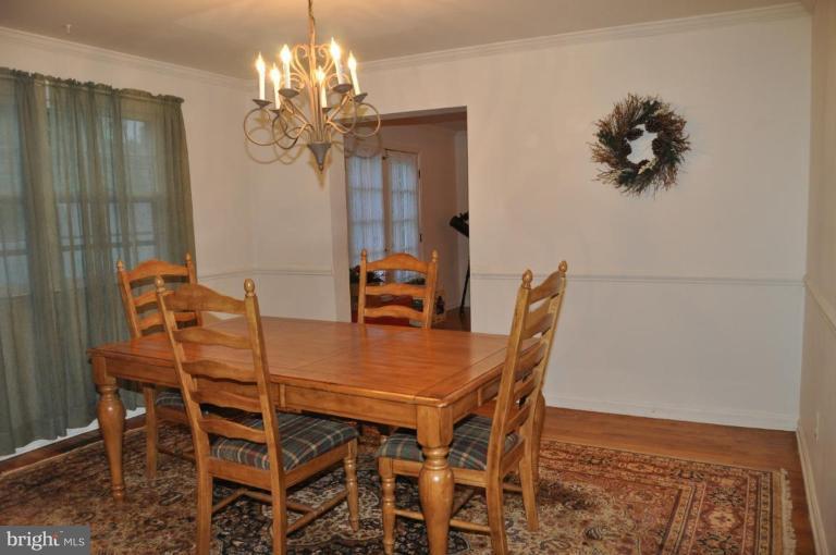 10507 Gateridge Road Cockeysville, MD 21030 - Photo 5 of 18 a view of a dining room with furniture and chandelier