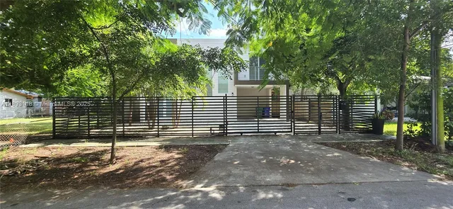 a view of a house with a street